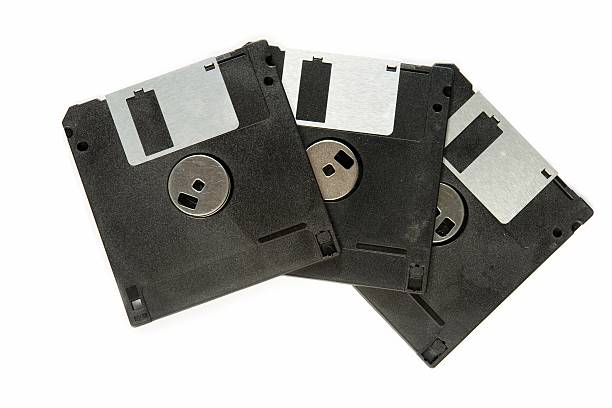 Ancient Technology Three floppy disks on a white background fileserver stock pictures, royalty-free photos & images