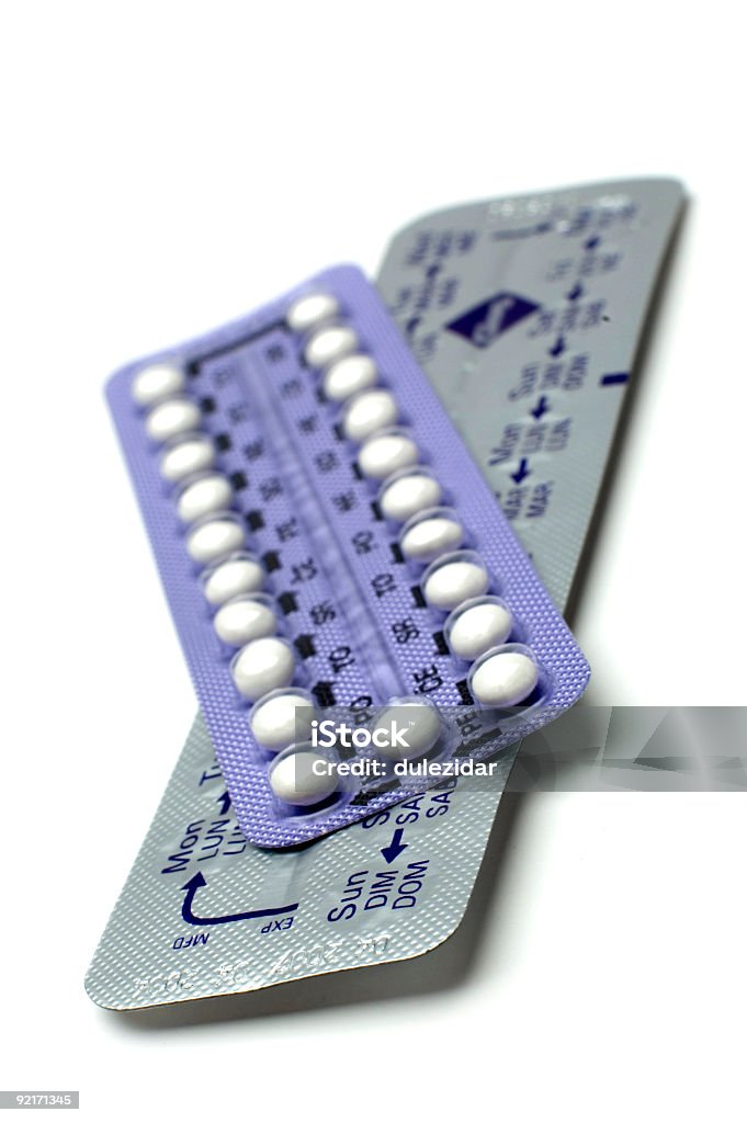 Two packs of small white pills isolated on white background birth control pills on white close up Birth Control Pill Stock Photo