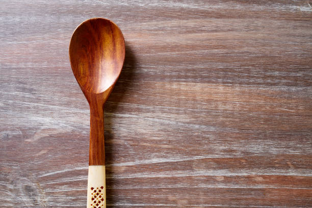 istock wood spoon on wooden board 921715622