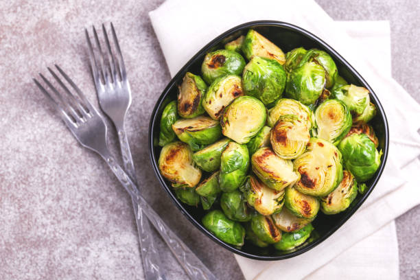 istock Vegetarian cuisine. Brussels Sprouts roasted with olive oil. Copyspace 921715674