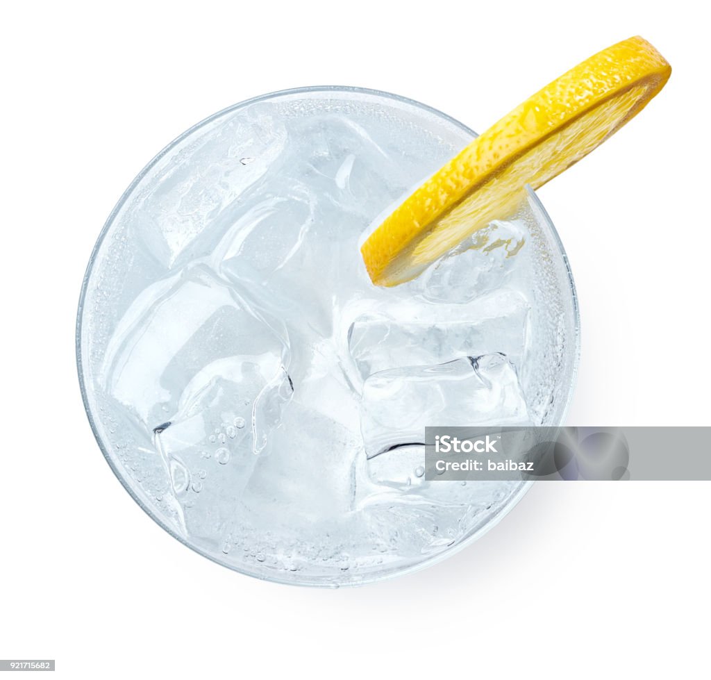 Glass of Gin and tonic Glass of Gin and tonic with slice of lemon isolated on white background. Top view High Angle View Stock Photo