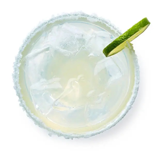 Glass of Margarita cocktail isolated on white background. Top view