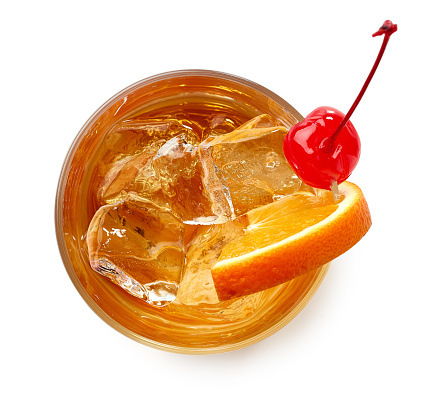 Glass of Old fashioned cocktail isolated on white background. Top view