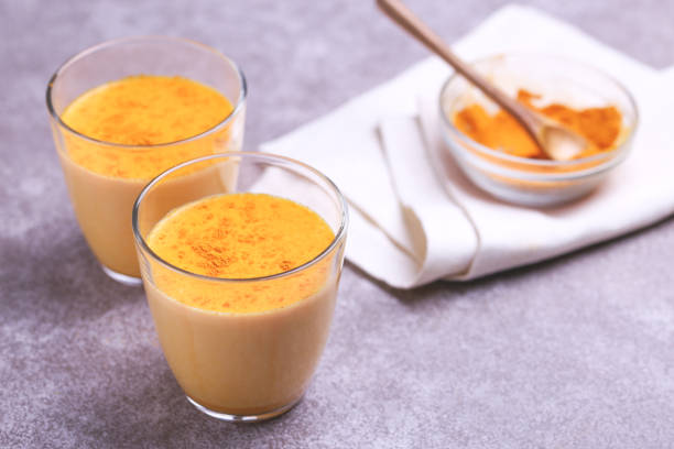 istock Indian turmeric milk with saffron, cardamom and turmeric. Copyspace 921717098