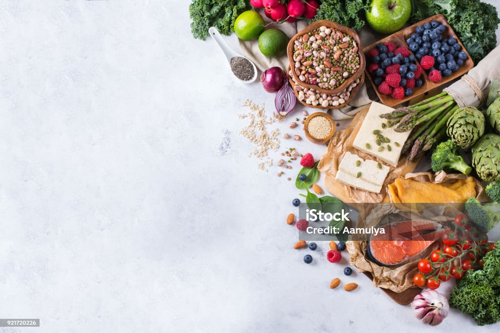 Selection assortment of healthy balanced food for heart, diet Selection assortment of healthy balanced food for heart, diet, detox, salmon fish, chicken breast, tofu, seeds nuts broccoli green spinach asparagus, berries Healthy Eating Stock Photo