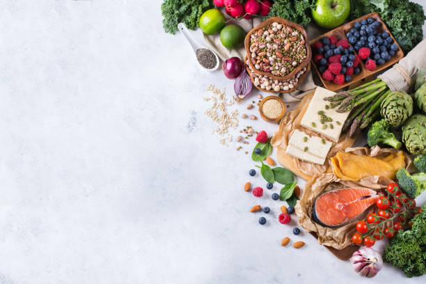 Selection assortment of healthy balanced food for heart, diet Selection assortment of healthy balanced food for heart, diet, detox, salmon fish, chicken breast, tofu, seeds nuts broccoli green spinach asparagus, berries food staple stock pictures, royalty-free photos & images