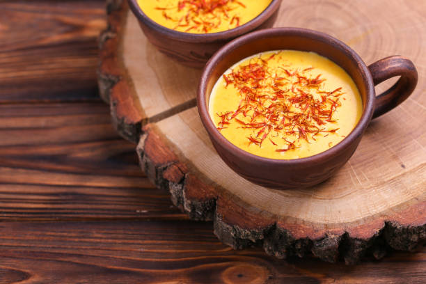 istock Indian turmeric milk with saffron, cardamom and turmeric. Copyspace 921720850