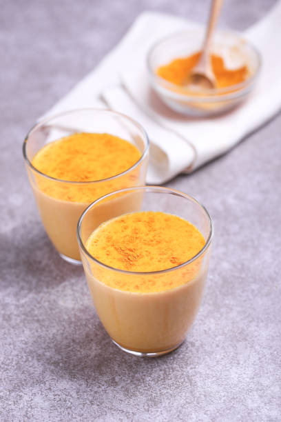 istock Indian turmeric milk with saffron, cardamom and turmeric. Copyspace 921720966