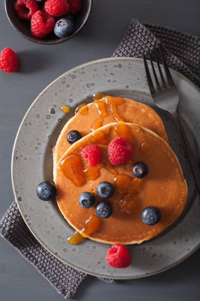 istock pancakes with blueberry raspberry honey and jam for breakfast 921721512
