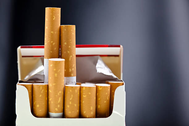 An up close view of a package of several cigarettes  stock photo