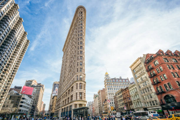 New York City, USA - The streets around the Flatiron Building in Midtown Manhattan busy with pedestrians and traffic.