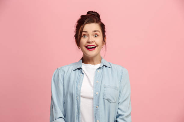 istock Beautiful woman looking suprised isolated on pink 921726888