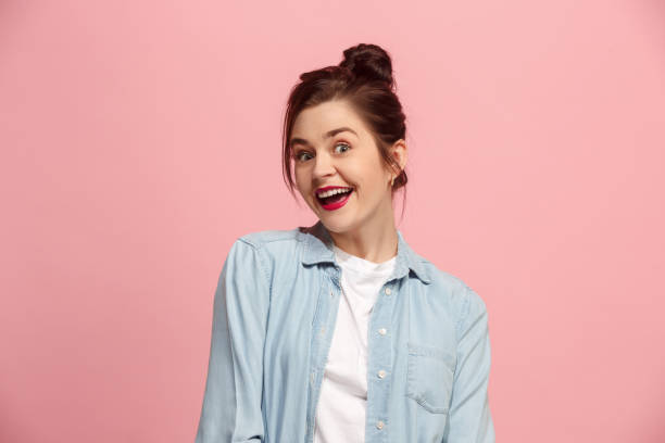 istock Beautiful woman looking suprised isolated on pink 921727264
