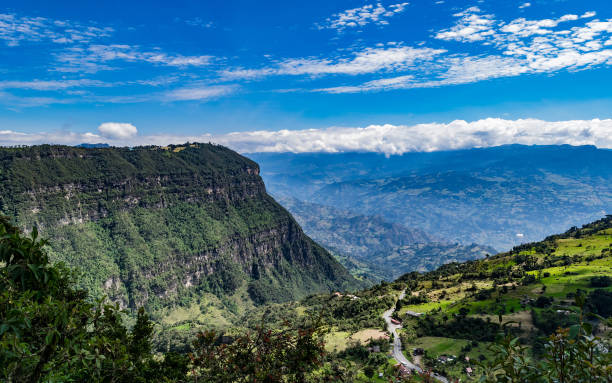 istock Blue sky green valleys and mountains 921730756