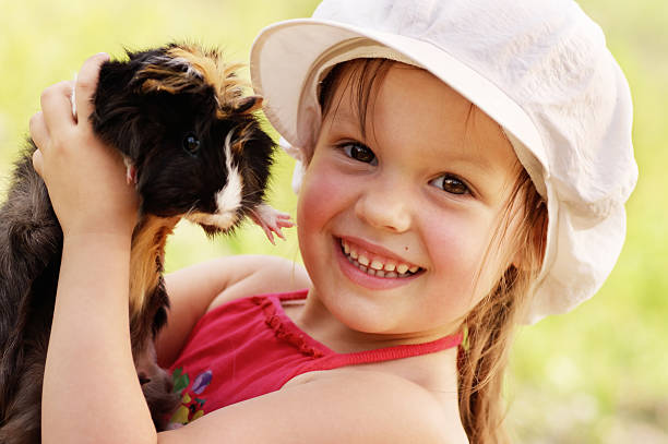 istock Girl and guinea-pig. 92173424