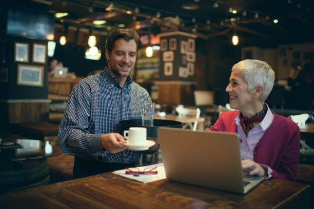 istock Waiter in coffee shop 921737756