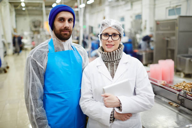 istock Workers of fish producing factory 921738260