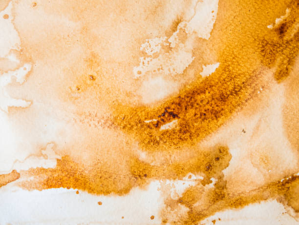 istock abstract watercolor backgrounds by use coffee painted on paper 921742920