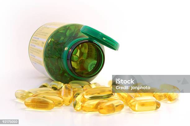 Capsules Spilling Out From The Jar Stock Photo - Download Image Now - Color Image, Erythropoietin, Horizontal