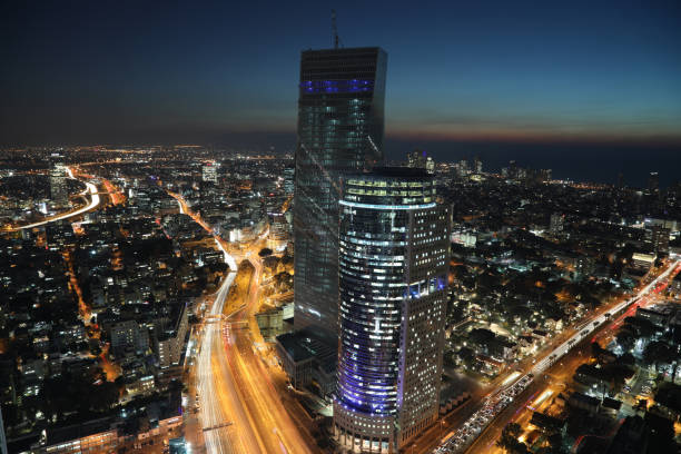 istock Modern cityscape skyscraper skyline panoramic aerial view night 921750852