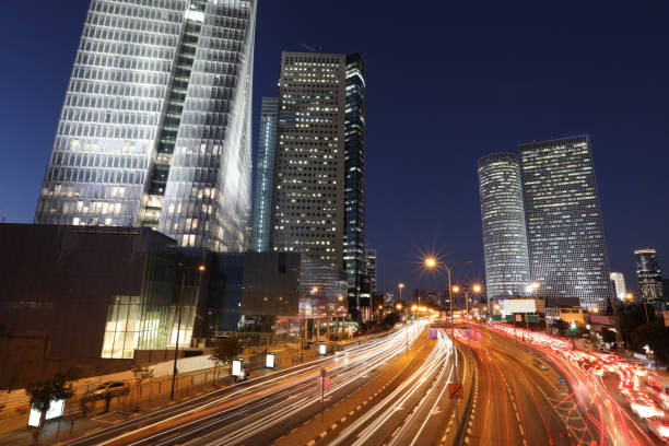 istock Modern cityscape skyscraper skyline panoramic aerial view night 921762940