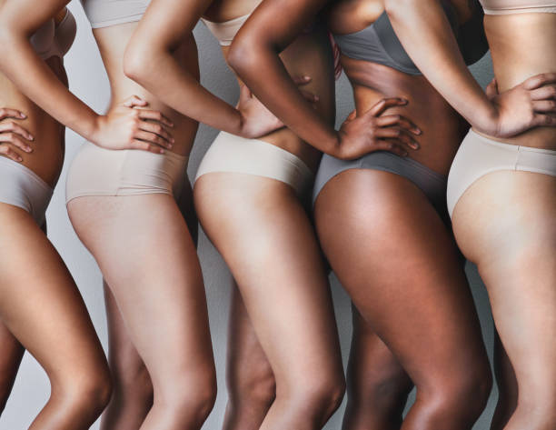 Love your skin, its the house you live in Studio shot of unrecognizable women posing against a grey background hand thigh stock pictures, royalty-free photos & images