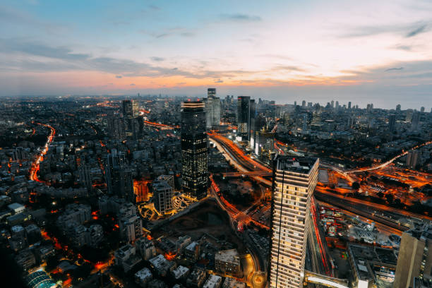 istock Modern cityscape skyscraper skyline panoramic aerial view night 921765740