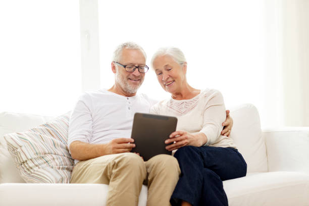 istock happy senior couple with tablet pc at home 921781272