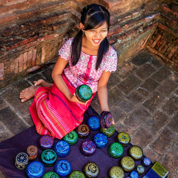 istock Young Burmese girl selling a lacquerware in Bagan, Myanmar 921781338