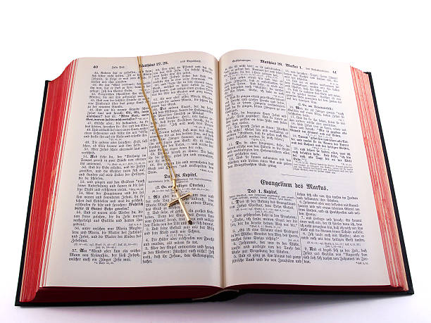istock Gold cross on old German Bible 92179245