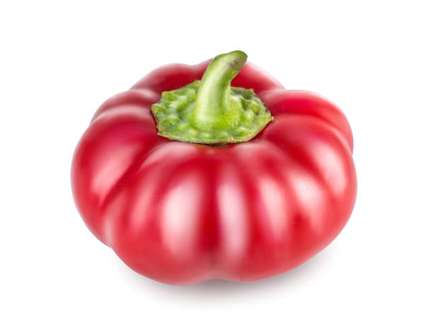 istock Raw red pepper with green tail, cut out with the texture. Side view, closeup isolated on white background. Sweet red pepper, ready to use in your project 921802564