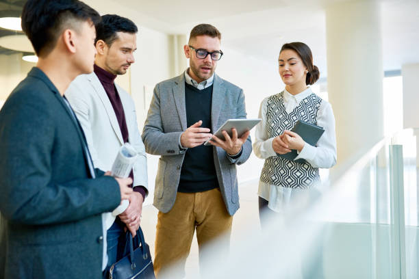 istock Modern Business People Chatting in Office 921805822