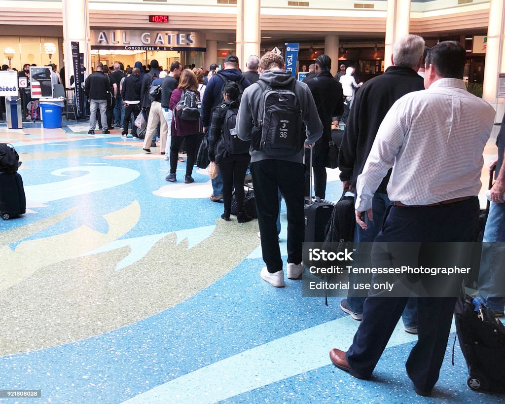 Waiting in the airport security line Jacksonville, Florida-February 5, 2018:  Travelers waiting in the long security lines at Jacksonville International airport. Airport Stock Photo
