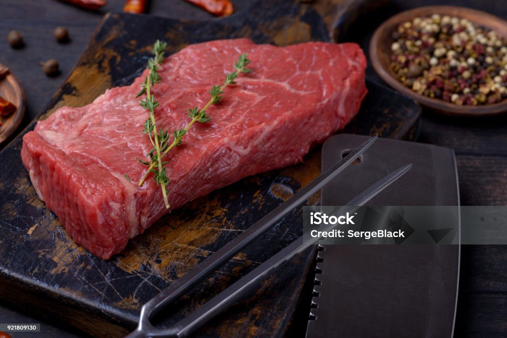 Beef steak meat and thyme Beef steak meat and thyme. Concept tasty dinner Backgrounds Stock Photo