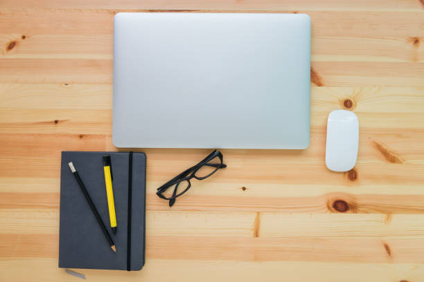 istock Computer laptop with accessories device on table desk, Workplace and office concept 921811238