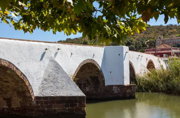 The Ponte Romana bridge leading into the historic town of Silves in the Algarve region of Portugal.