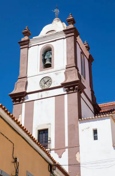 The bell tower of the historic Silves Cathedral in the beautiful town of Silves in Portugal.