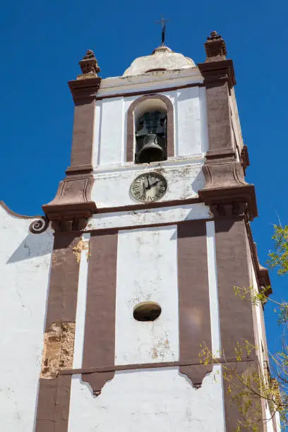 The beautiful bell tower of Silves Cathedral in the historic town of Silves in Portugal.