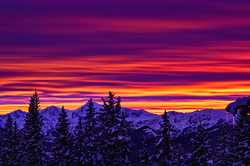 Sunset Mountain View with Alpenglow - Scenic landscape in winter with mountains and amazing sunset light.