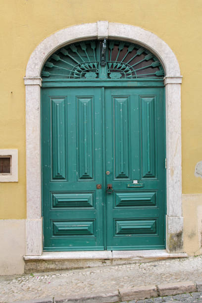 istock elegant green wooden door 921825078