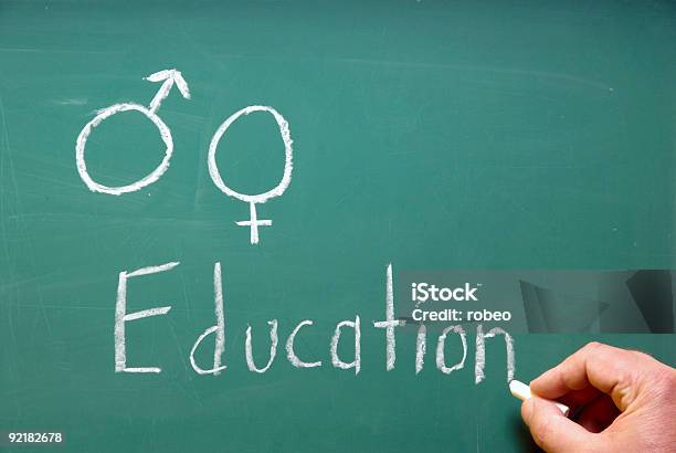 Hand Writing Chalk On Blackboard Titled About Sex Education Stock Photo - Download Image Now