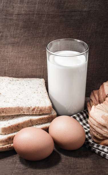 istock Bread with egg and milk on the wood. 921827432