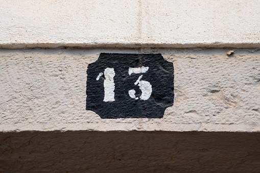 The number 13 painted above a doorway.