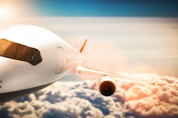 istock Passenger airplane flying at sunshine, blue sky. 921828552