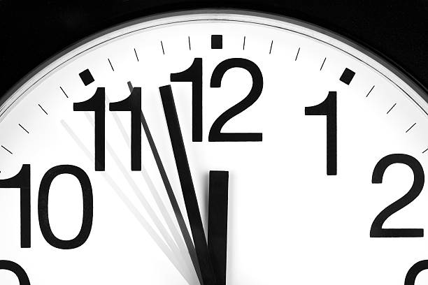 istock Analog clock showing the time of 1157 and 56 seconds 92183767