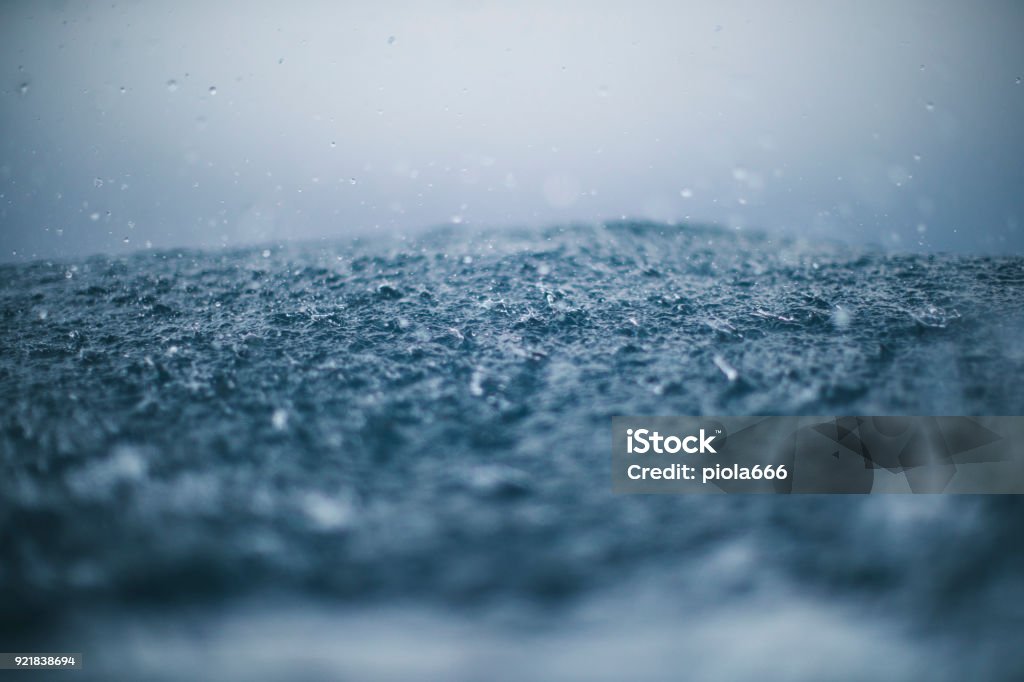 Rough sea and rain drops Rough sea and waves crashing: Mediterranean landscape Rain Stock Photo