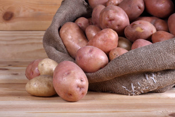 istock Pink potatoes in bag 921839036