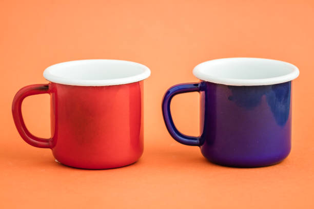 istock Colorful Enamel Mugs on Orange Background 921841626
