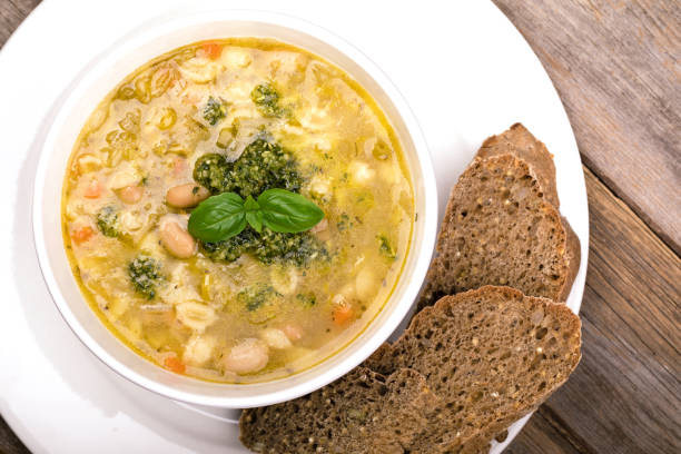 minestrone with fresh pesto and brown seeded bread. - oregano freshness herb brown imagens e fotografias de stock