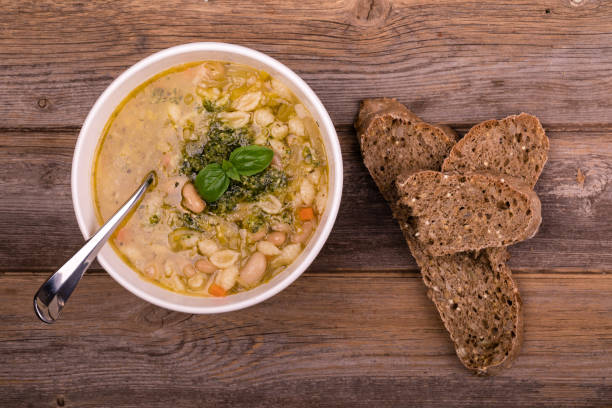 minestrone with fresh pesto and brown seeded bread. - oregano freshness herb brown imagens e fotografias de stock